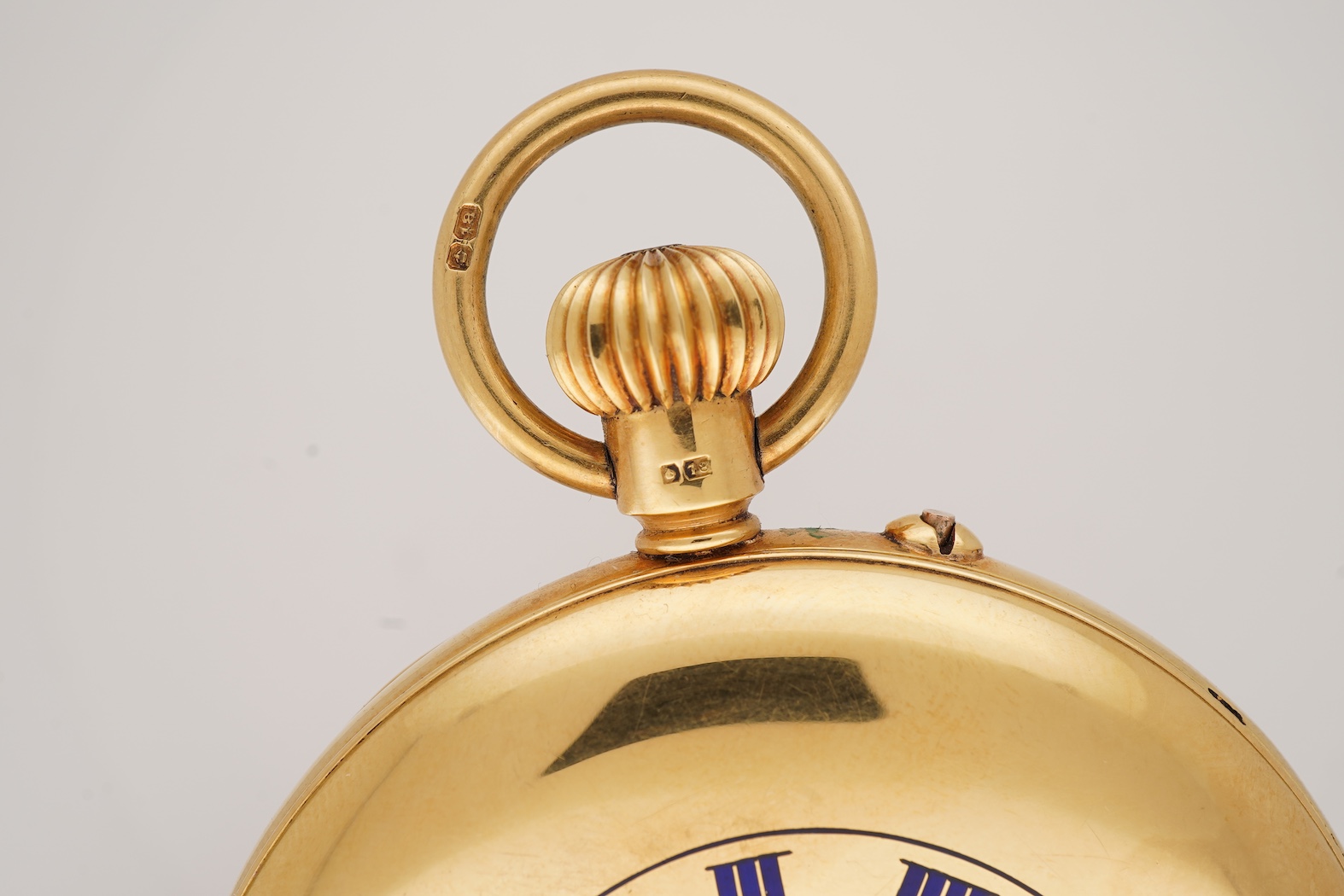 A George V 18ct gold half hunter keyless lever pocket watch, retailed by Mappin